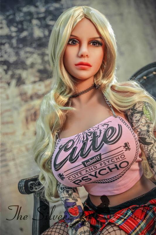 Violet blonde in pink top and miniskirt