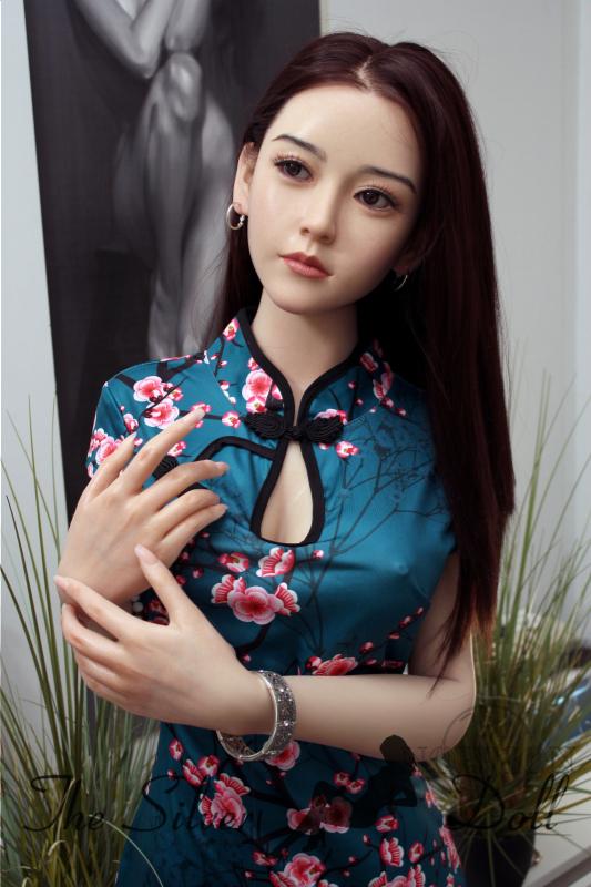 Xiu in a floral-patterned dress