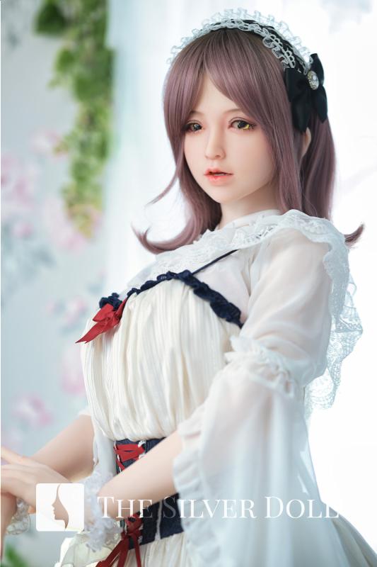 Sayaka wears a classic white dress